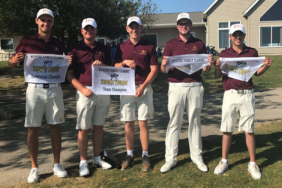 Mount Mercy - Klocke 5 Students holding winning banners.