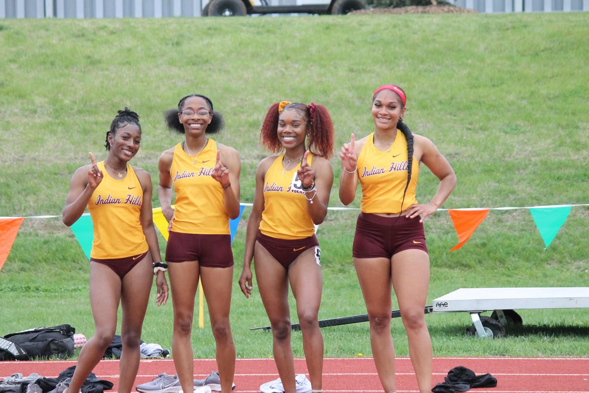 SIMMONS, 4X400 WIN REGION TITLES